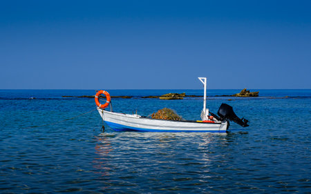 Isolated fishing boat docked in the harbor