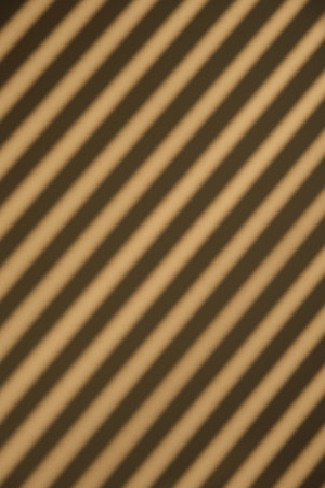 Diagonal brown striped pattern background, texture close up.の写真素材