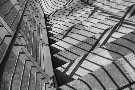 Abstract Urban Staircase with Dramatic Shadows in Black and White.