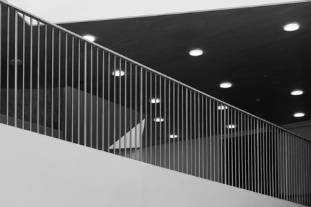 Abstract minimalist interior with railing and lights.の写真素材