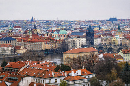 Prague, Czechia - December 20, 2024: Aerial View of Historic Prague and Charles Bridge Over Vltava...