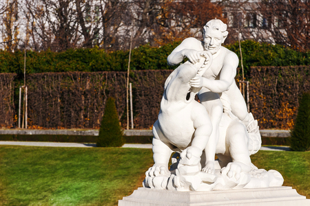 Sculptures in the fountain in the Belvedere Palace garden in Vienna, Austriaの写真素材
