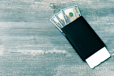 Passport with money and boarding pass for travel concept.
