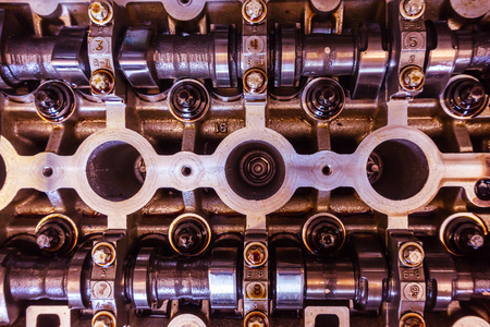Close up of parts in cars engine head, camshaft and valve systemの写真素材