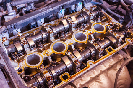 Mechanic with wrench working and repair car engine in car service centre, Camshaft repairing or...