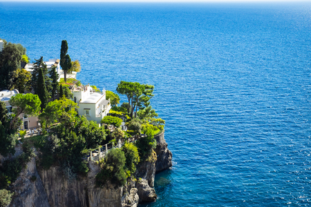 Italian house on a cliff near tyrrhenian sea coast, Amalfi coast, Italy.の写真素材