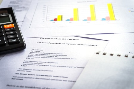 Checking financial reports. Graphs and charts. Accounting analysis concept.の写真素材