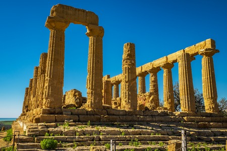 Ruined Temple of Heracles columns in ancient Valley of Temples, Agrigento, Sicily, Italy.の写真素材