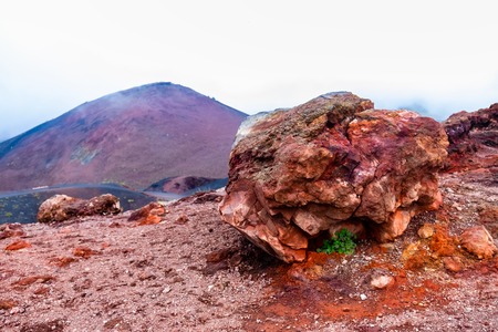 Stone on the slope of Etna volcano with its barren landscape and lava stones.の写真素材