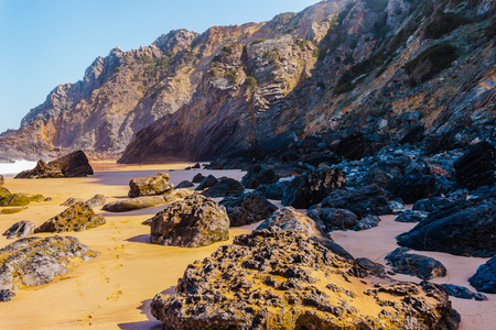 Stones of rocks on the west Atlantic coast of Portugal on Adraga beachの写真素材