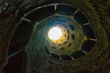 The Well of Quinta da Regaleira from below. A romantic staircase in Sintra in Portugal