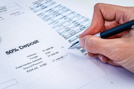 Accounting business concept. Calculator with accounting report and financial statementの写真素材