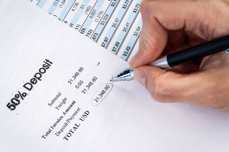 Accounting business concept. Accounting report and financial statement on desk.の写真素材