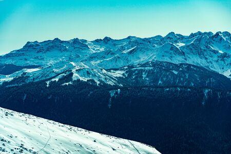Snow covered beautiful mountain peaks. Winter landscapeの写真素材