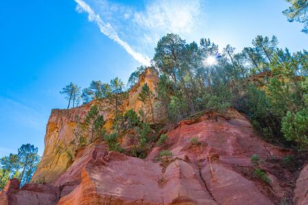 Roussillon, red rocks colorful ochre canyon in Provence, France.の写真素材