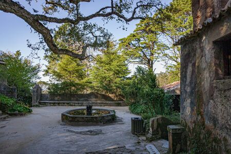 Ancient rocks and stone building. Convent of the Capuchos, Sintra, Lisbon Region, Portugalの写真素材