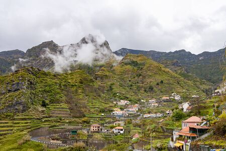 Beautiful landscape of green mountains in madeira island during rain, Portugal