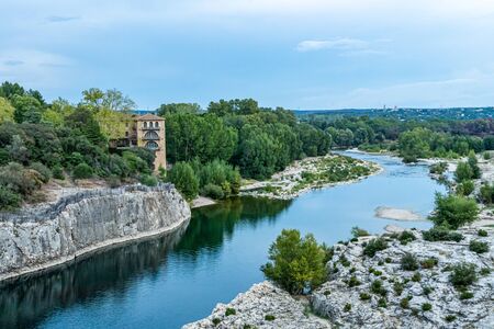 Gardon river beneath Pont du Gard, at evening in Nimes, Franceの写真素材