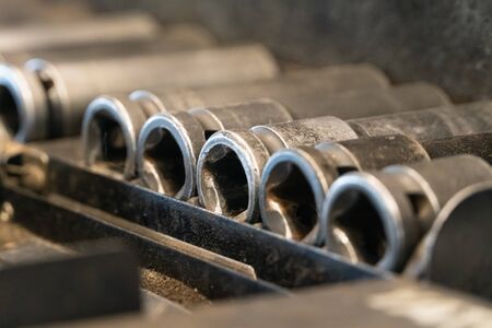 A set of tools for repair in car service - mechanic's hands, close upの写真素材