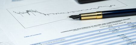 Income statement financial report with pen. Investment analysis. Wide bannerの写真素材