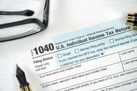 1040 Tax Form. Tax Payment Concept. Filing Taxes Document on Table in Office. Individual Income Tax Returnの写真素材