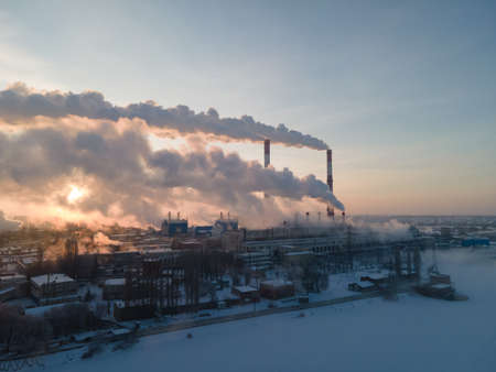 Aerial view of Industrial plant pipe and Global warming concept. Air pollution by smoke of the factory chimneys in the industrial zoneの写真素材