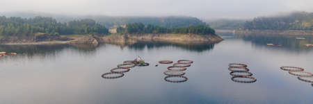 Fish farm with floating circle cages. Fish breeding and seafood industryの写真素材