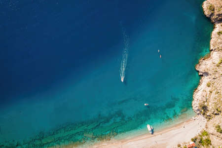 Aerial top view on speed boat row in blue sea. Summer holiday and sea tourismの写真素材