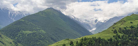 Fantastic view of mountains in North Ossetia, Alania with cloudy sky. Concept of travel the world....