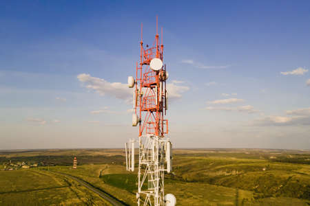 Telecom tower witn 4G network, telecomunication base station. 5G antenna witn 5G technology in rural...