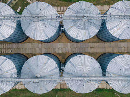 Grain storage in large silos aerial view. Silo with grain. Grain storage tank view from aboveの写真素材