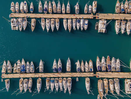 Aerial view of the yacht club. Aerial top-down view of docked sailboats. Top down view of yachtsの写真素材