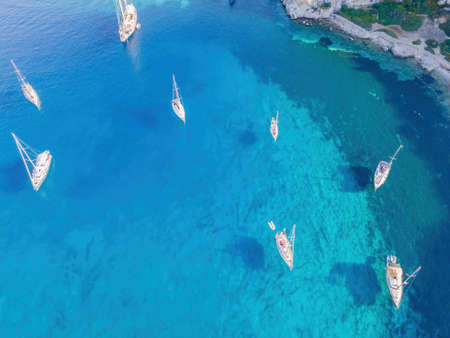 Yachts on lagoon at sunny day. Sailing boat. Yacht in the sea, aerial view from drone.