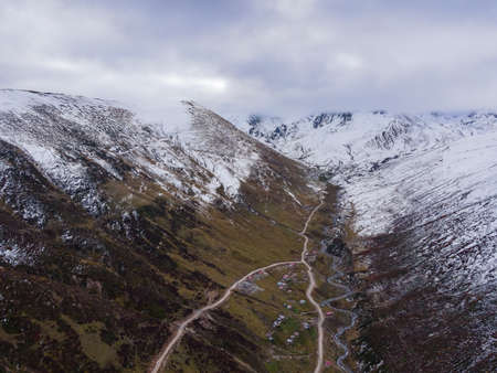 Mountain valley with fog and clouds at morning. Aerialの写真素材