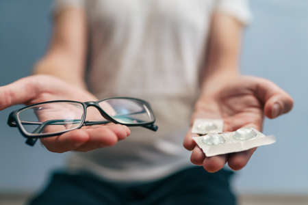Man hold glasses and contact lens for choose. Optic health treatment. Ophthalmology and eyes care...