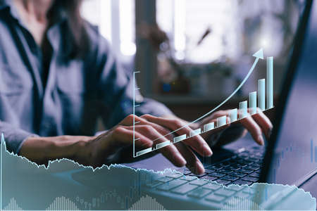 Economy graph: rising arrow on digital screen for woman with laptop. Inflation and stagnation,...