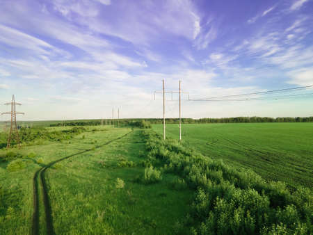 Transmission tower, power tower or electricity pylon, rural infrastructure. High-voltage power line or overhead power line. aerial view.の写真素材