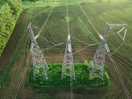 High voltage power line on industrial electricity line tower for electrification rural countrysideの写真素材