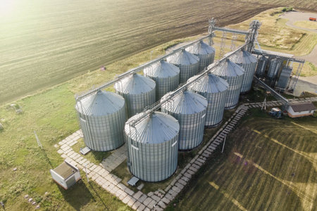 Aerial wide shot of agricultural grain silo storage tanks