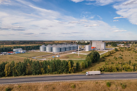 Tanks of storage elevator for processing and storage of soybean and wheat grain. Aerial viewの写真素材