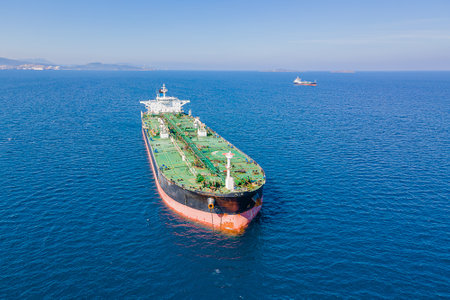 Crude oil tanker waiting for uploading near a sea port at the anchorageの写真素材