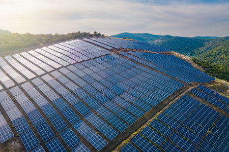 Solar panel produces green, environmentally friendly energy from the setting sun. Aerial view