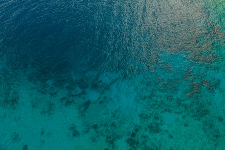 Aerial top down view of crystal sea surface water, static shot for backgroundの写真素材