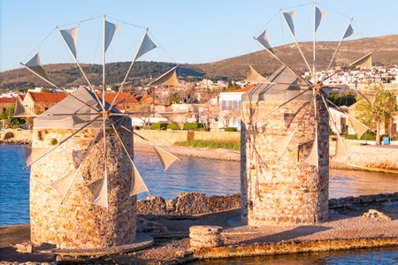 Windmills old ancient design on Aegean sea shore greek island Chios with wooden propellors, Aerial viewの写真素材