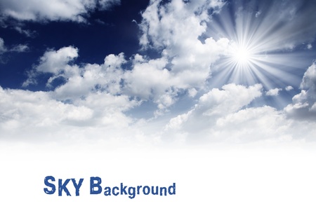 white fluffy clouds in the blue skyの写真素材