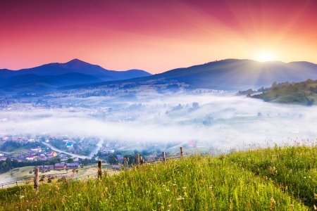 Beautiful summer landscape in the mountain village. Dramatic sky. Carpathian, Ukraine, Europe. Beauty world.の写真素材