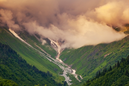 Majestic colorful sunset at the foot of  Mt. Ushba. Upper Svaneti, Georgia, Europe. Caucasus mountains. Beauty world.の写真素材