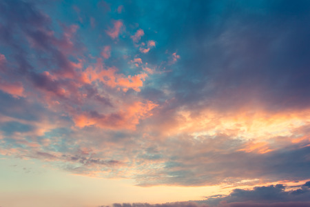 Beautiful nature background. Fantastic colorful sunset and dark ominous clouds. Beauty world.