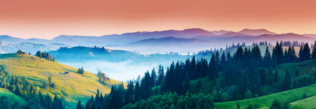 Fantastic morning mountain landscape. Overcast colorful sky in Carpathian, Ukraineの写真素材