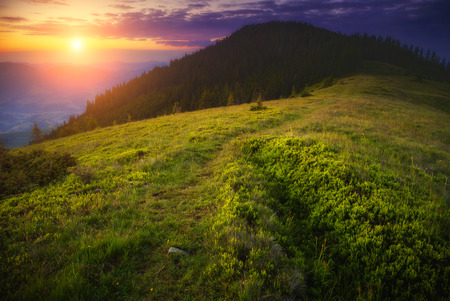 Fantastic summits glowing by sunlight. Dramatic and picturesque morning scene. Carpathian, Ukraineの写真素材